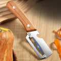 Stainless steel peeler slicing fruits and vegetables